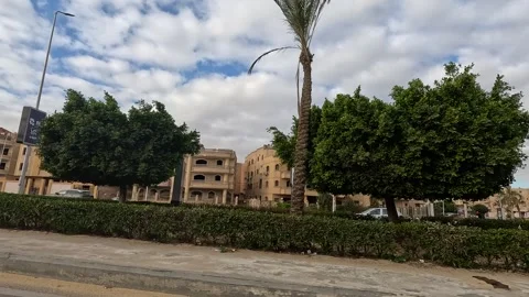 Car Driving Through Quiet Urban District Streets New Cairo Showing Buildings Stock Footage 329706963