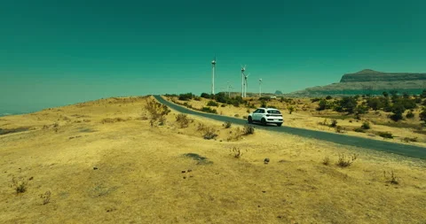 Car Driving Through Scenic Windmill Landscape Stock Footage 304105848
