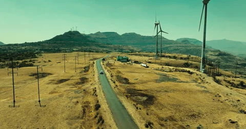 Car Driving Through Scenic Windmill Landscape Stockbeeldmateriaal 304106233