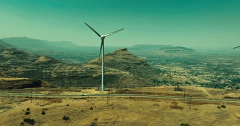 Car Driving Through Scenic Windmill Landscape Stockbeeldmateriaal 304106280
