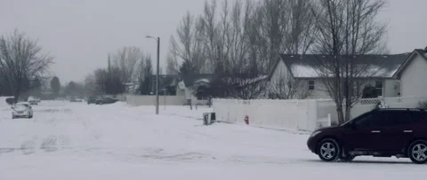 Car Driving through Snow in Slow Motion - Anamorphic Video stock 206806194
