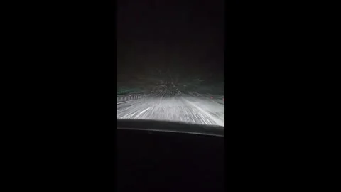 Car Driving Through Snow on Winter Road Vídeos de archivo 328288819