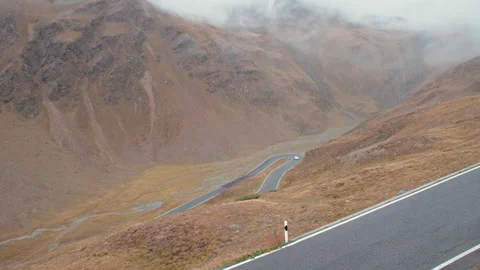Car driving through the stelvio pass Stock Footage 169589042