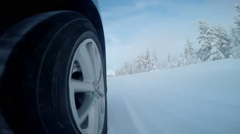 Car driving through thick snow with wheel camera Vídeo Stock 47532017