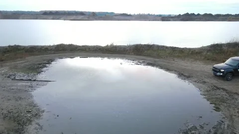 Car driving through water Stock Footage 169341499