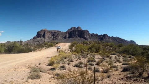 Car driving toward mountain Stock Footage 167243939