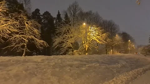 Car driving by on winter night Stock Footage 148886576