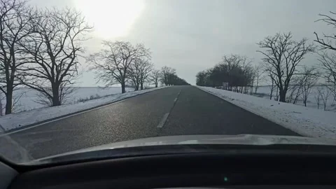 Car driving on a winter road Stock Footage 147861789