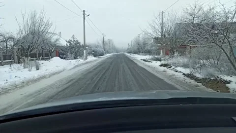 Car driving on a winter road Stock Footage 147861882