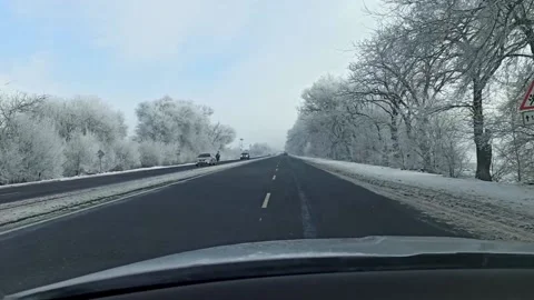 Car driving on a winter road Stock Footage 147862033