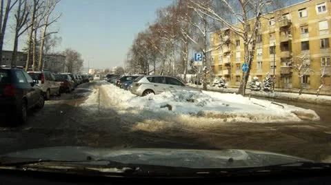 Car driving in winter by snow Stockbeeldmateriaal 10812596