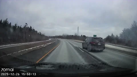 Car Driving on the Wrong Side of the Highway, Nova Scotia, Canada - 26 Dec 2025 Stock Footage 325347899
