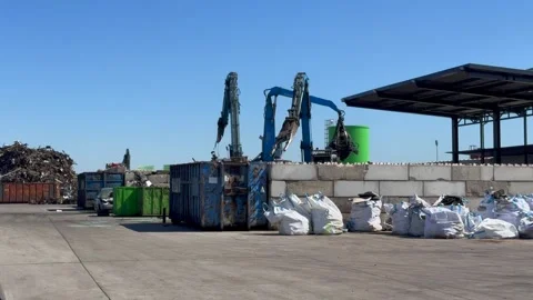 Car dump junkyard with mechanical cranes dismantling and recycling old vehicle Stock Footage 308013566