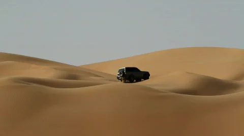 Car in the dunes of desert Stock Footage 561683