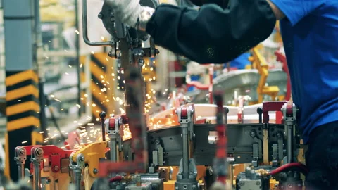 Car element is being spot-welded by a factory worker. Automotive industry Vidéo 141120936