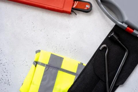 Car emergency kit - warning triangle danger sign, first aid kit and reflective Stock Photos