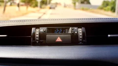 Car emergency light button and clock digital display. 스톡 사진