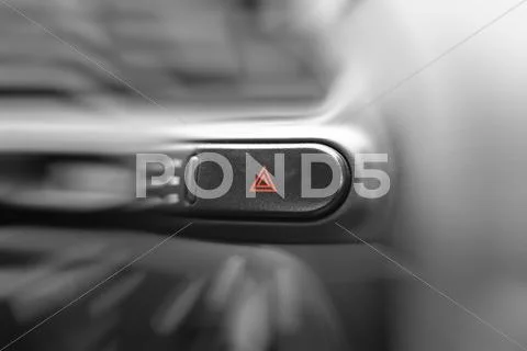 Car emergency lights button on cockpit. very shallow dof. Stock Photos