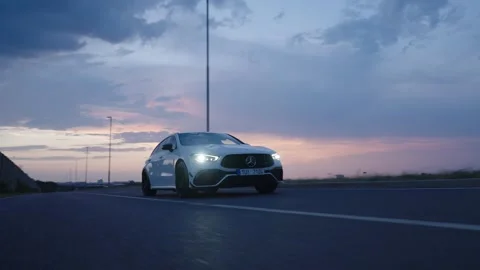 Car on empty road at sunset Stock Footage 346262548
