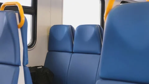The car is an empty train. Blue seats on the train. Stock Footage 232915252
