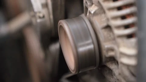 Car engine alternator pulley and belt rotating Stock Footage 327401976