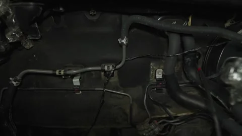 Car engine bay firewall with brake lines and vacuum hoses Stock Footage 340334778