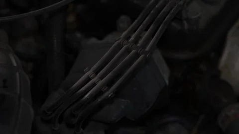Car engine bay with high voltage ignition spark plug wires. Stock Footage 344365686