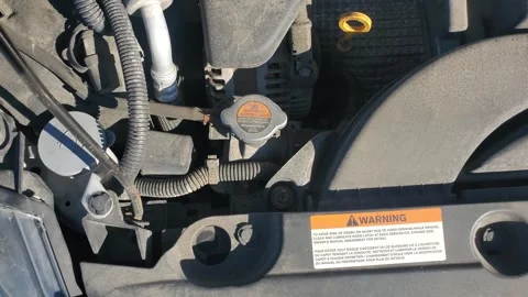 Car engine bay with radiator cap washer reservoir and oil dipstick Видео 331275233
