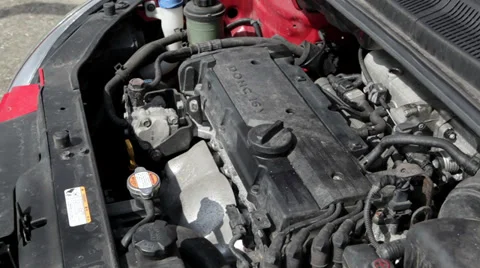 Car engine bay, starting the motor of a compact car Stockbeeldmateriaal 36814379