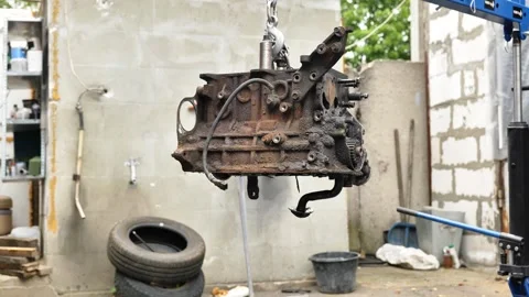 Car engine block repairing with hoist at service station Video stock 320494591