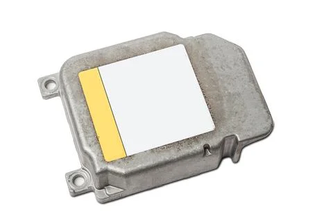 Car engine control unit with metal elements on a white isolated background is Stock Photos