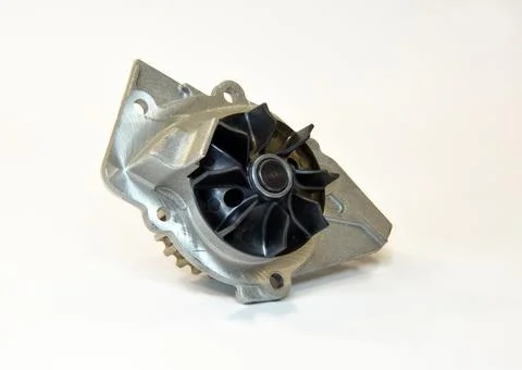 Car engine coolant water pump new on a white background. Spare part. Stock Photos