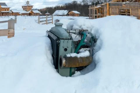 Car engine covered with snow Stock Photos