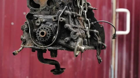 Car engine hanging in chain during repair process 스톡 동영상 319403167