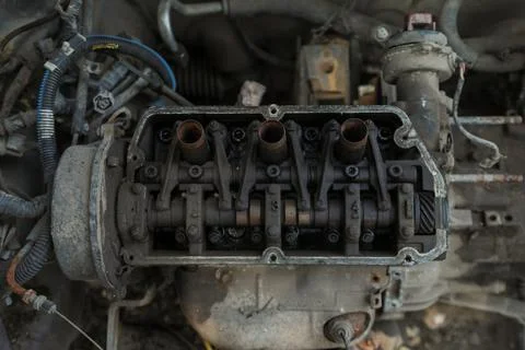 A Car Engine Head top showing Crank Shaft Stock Photos