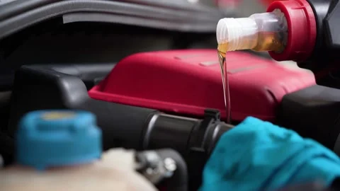 Car engine oil change. close-up. Stock Footage 203981336
