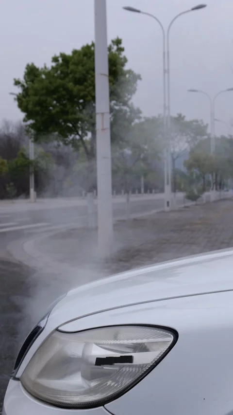 The car engine overheats and steams and keeps blowing white smoke. Stock Footage 329167494