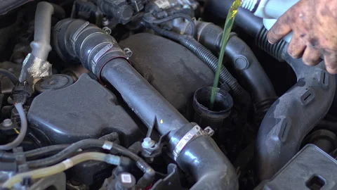 Car Engine Pouring Oil in Workshop Stock Footage 161087433