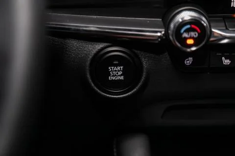 Car engine push start stop button ignition remote starter. Car dashboard:  bl Stock Photos