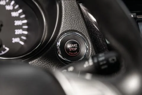 Car engine push start stop button ignition remote starter. Car dashboard:  bl Foto stock