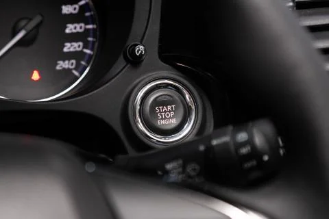Car engine push start stop button ignition remote starter. Car dashboard Stock Photos