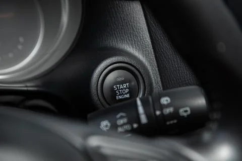 Car engine push start stop button ignition remote starter. Car dashboard Stock Photos
