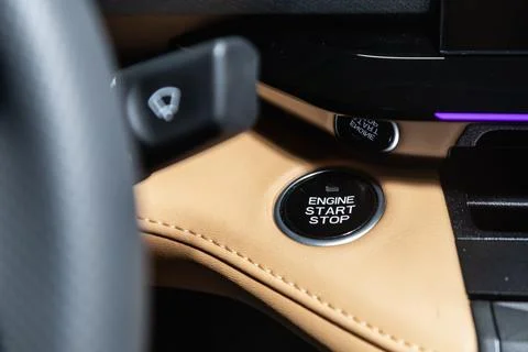 Car engine push start stop button ignition remote starter. Car dashboard:  bl Stock Photos