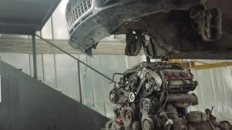 Car with engine removed in service Stock Footage 131299472