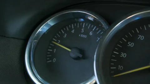 Car engine revving close-up dashboard shot showing tachometer needle rising Stock Footage 333617684