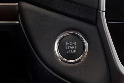 Car engine start and stop button. Modern and prestigious vehicles. Stock Photos