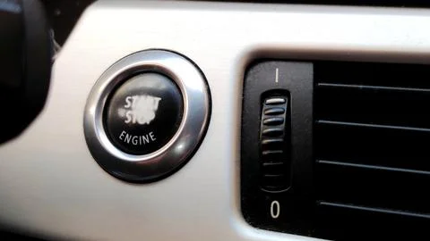 Car engine start button black and white close-up with blurred background Stock Photos