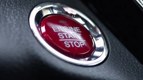 Car engine start button pressed Stock Footage
