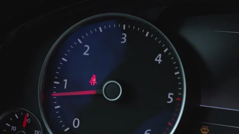 Car engine start with dashboard tachometer and seat belt warning light Stock Footage 323909450