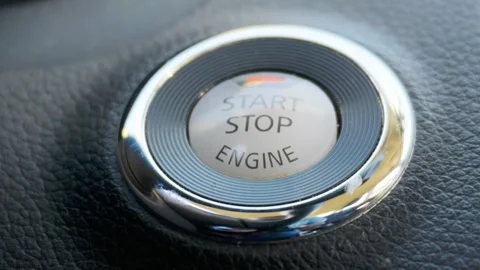Car engine start stop push button switch close up Stock Footage 341794107